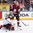 COLOGNE, GERMANY - MAY 16: Germany's Philipp Grubauer #30 makes the save while Latvia's Zemgus Girgensons #28 looks on during preliminary round action at he 2017 IIHF Ice Hockey World Championship. (Photo by Andre Ringuette/HHOF-IIHF Images)

